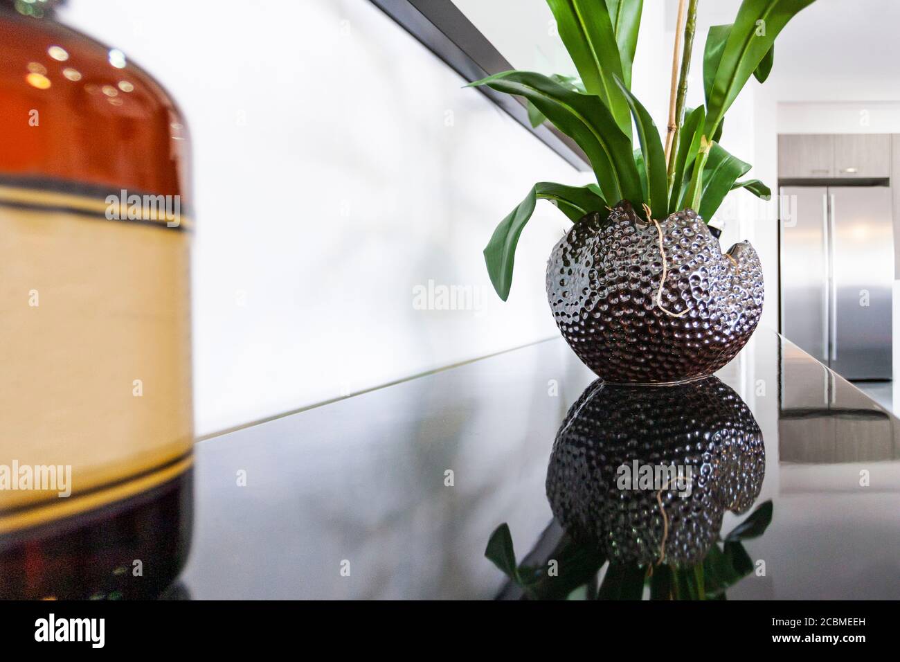 A vase of flowers on a kitchen table Stock Photo Alamy