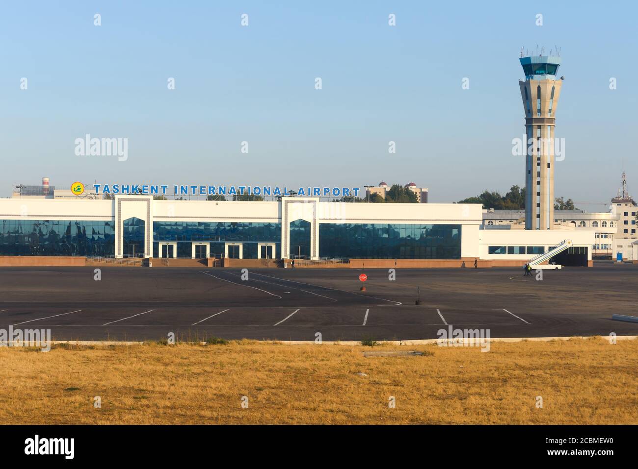 Islam Karimov Tashkent International Airport passengers terminal in Uzbekistan. Tashkent Airport and air traffic control tower. Uzbekistan Airways. Stock Photo