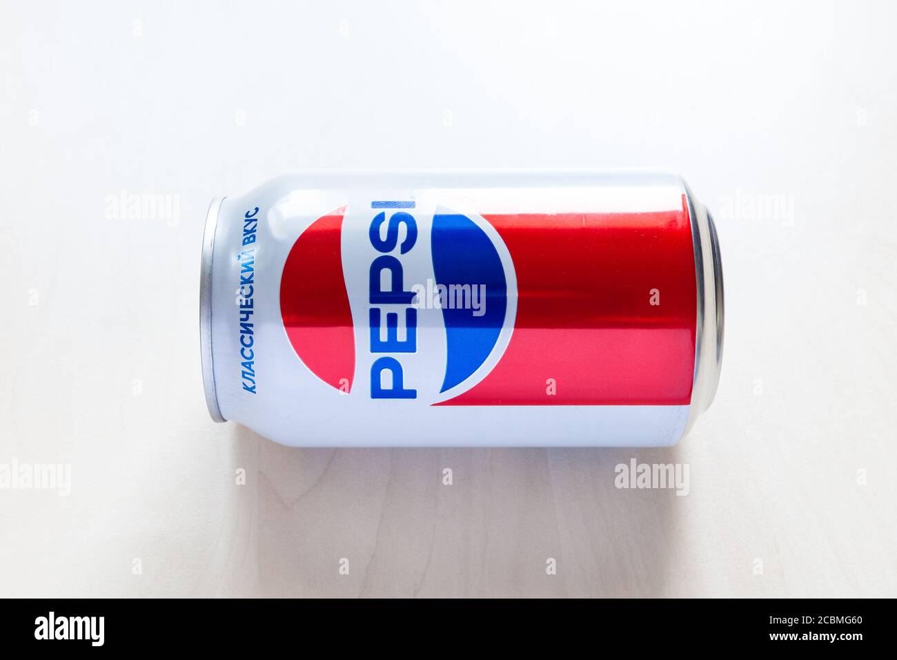 MOSCOW, RUSSIA - AUGUST 6, 2020: limited edition can of Pepsi with design from the 80s of the 20th century on lies light brown table. Pepsi is carbona Stock Photo