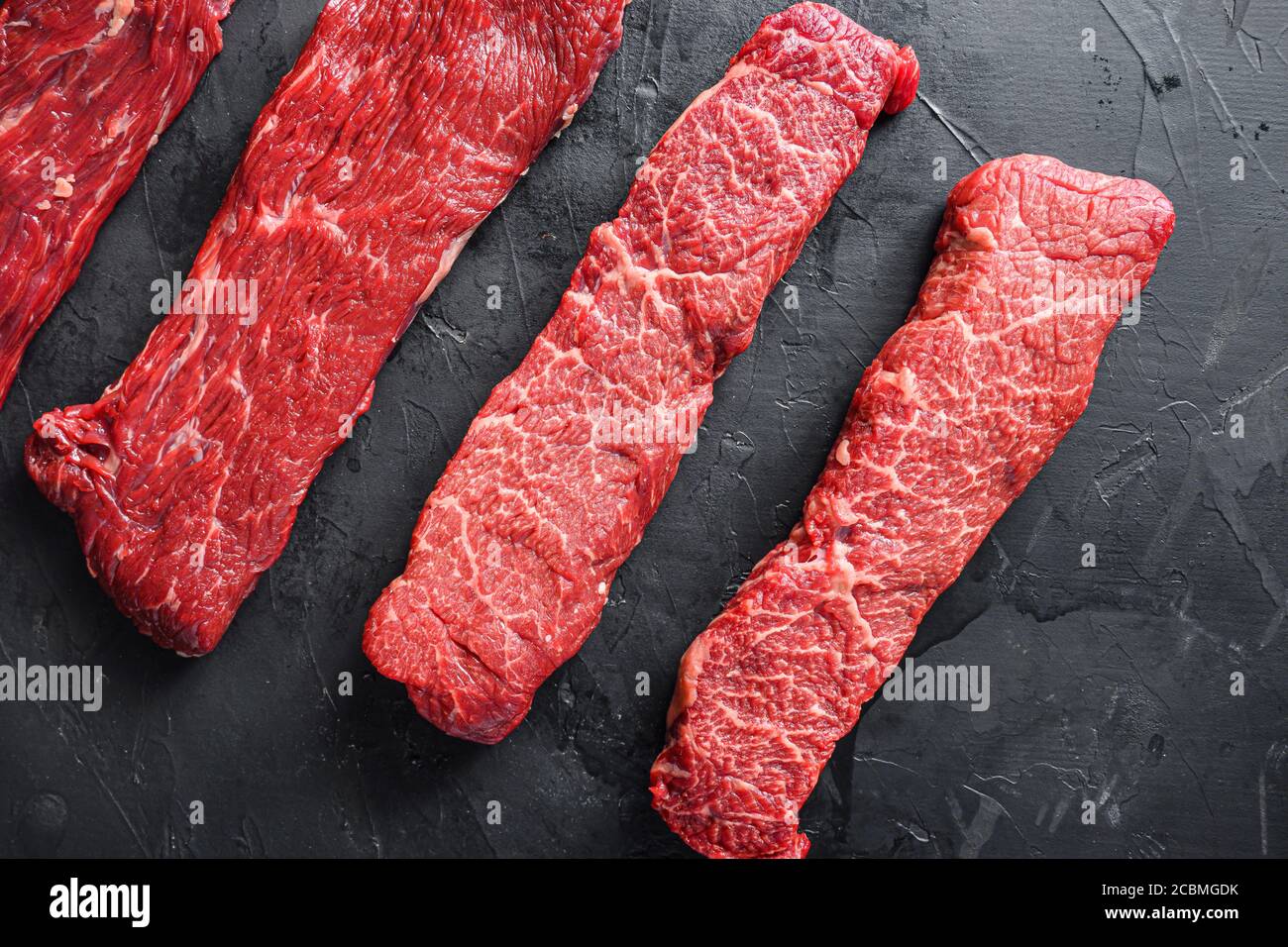 Raw, alternative beef steaks flap flank Steak, machete steak or skirt cut, Top blade or flat
