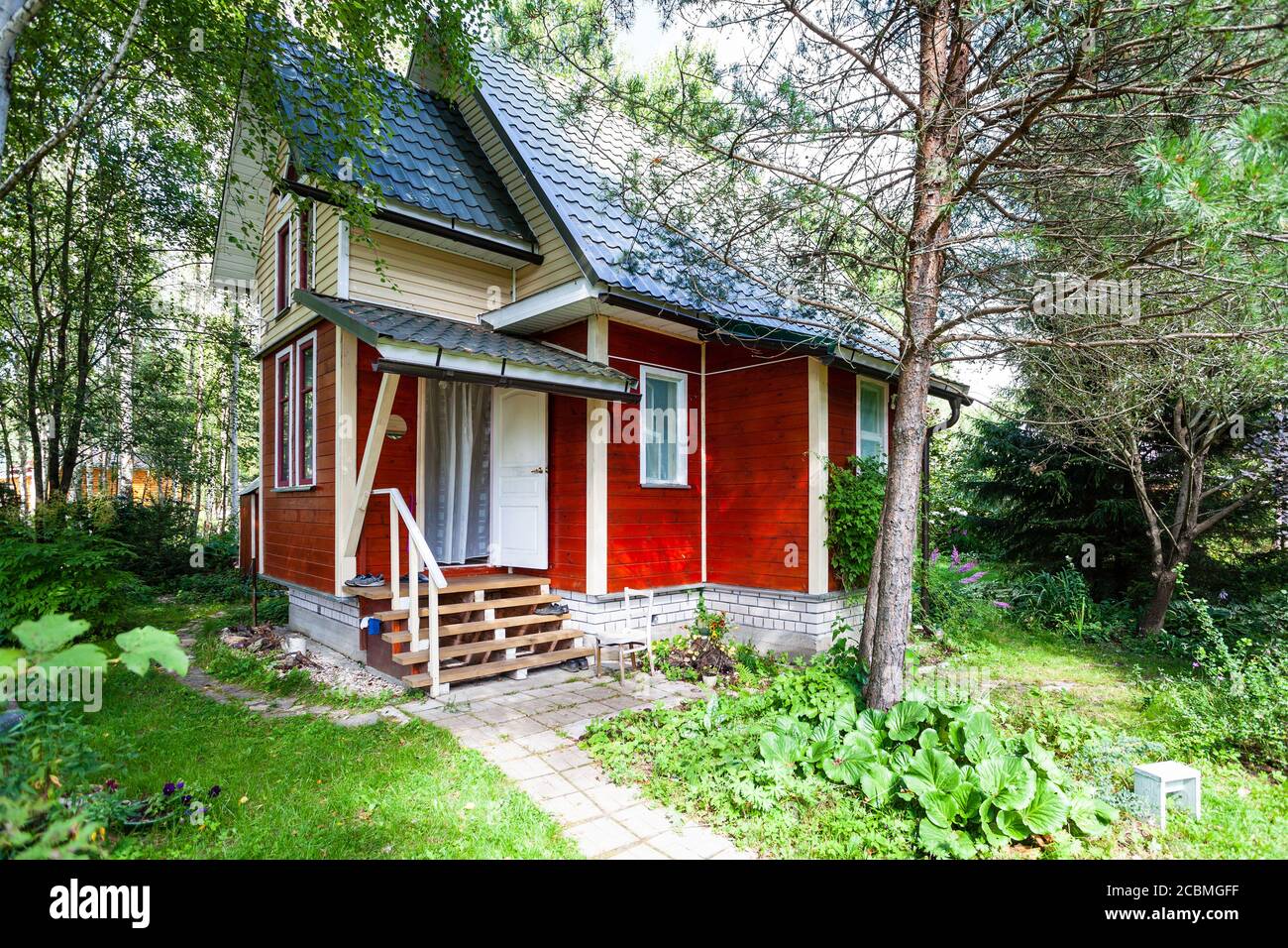 one-storey wooden country house with attic in Russia in summer Stock ...