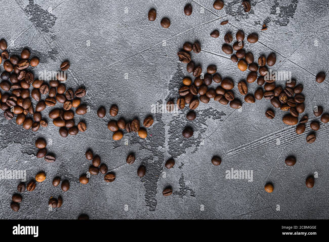 Roasted coffee beans on grey textured background, top view Stock Photo ...