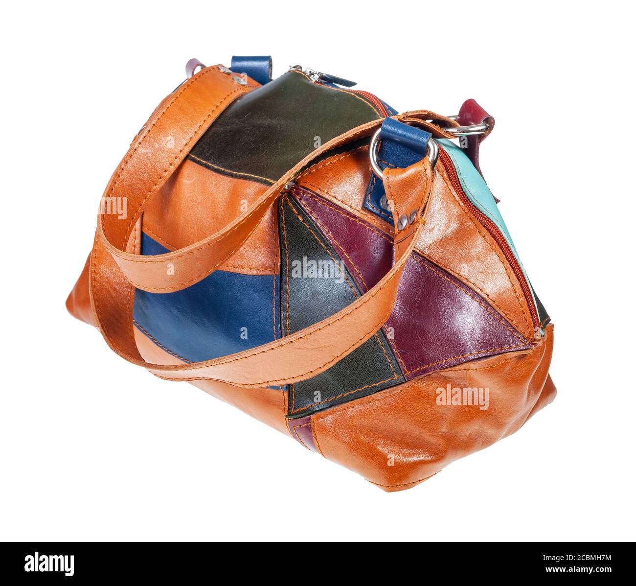 handcrafted patchwork leather travel bag isolated on white background Stock Photo