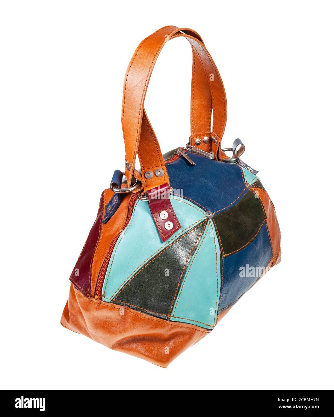 handmade patchwork leather travel bag isolated on white background Stock Photo