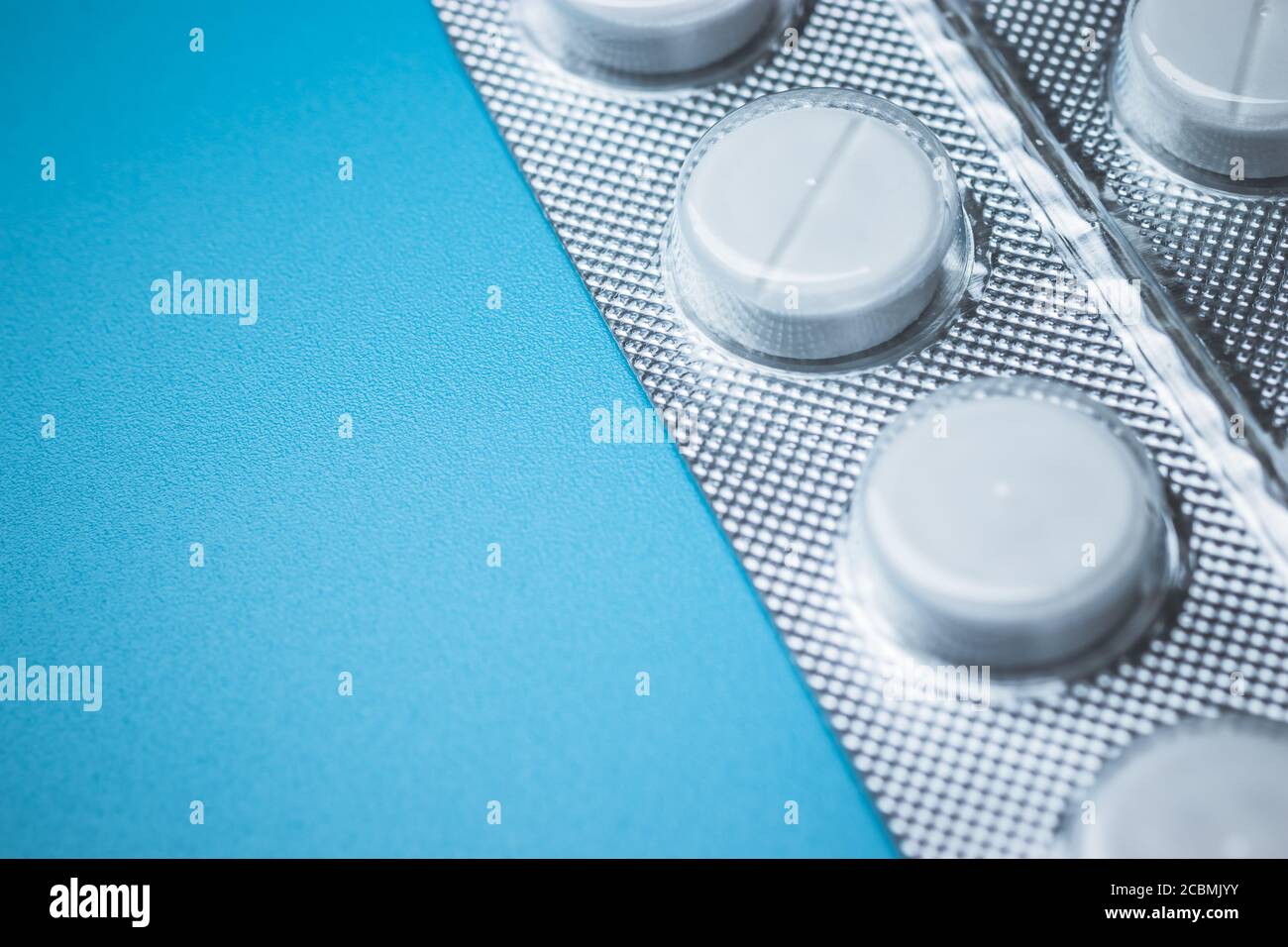 Simple white pills on background with copy space Stock Photo