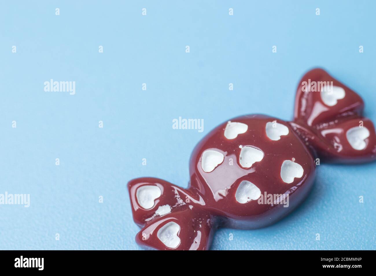 Toy candy on blue background with copy space Stock Photo