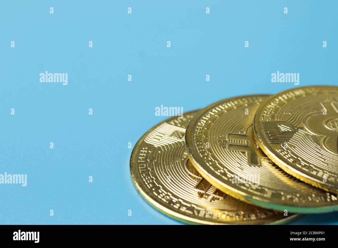 Bitcoin coins on blue background with copy space. Cryptocurrency BTC concept Stock Photo