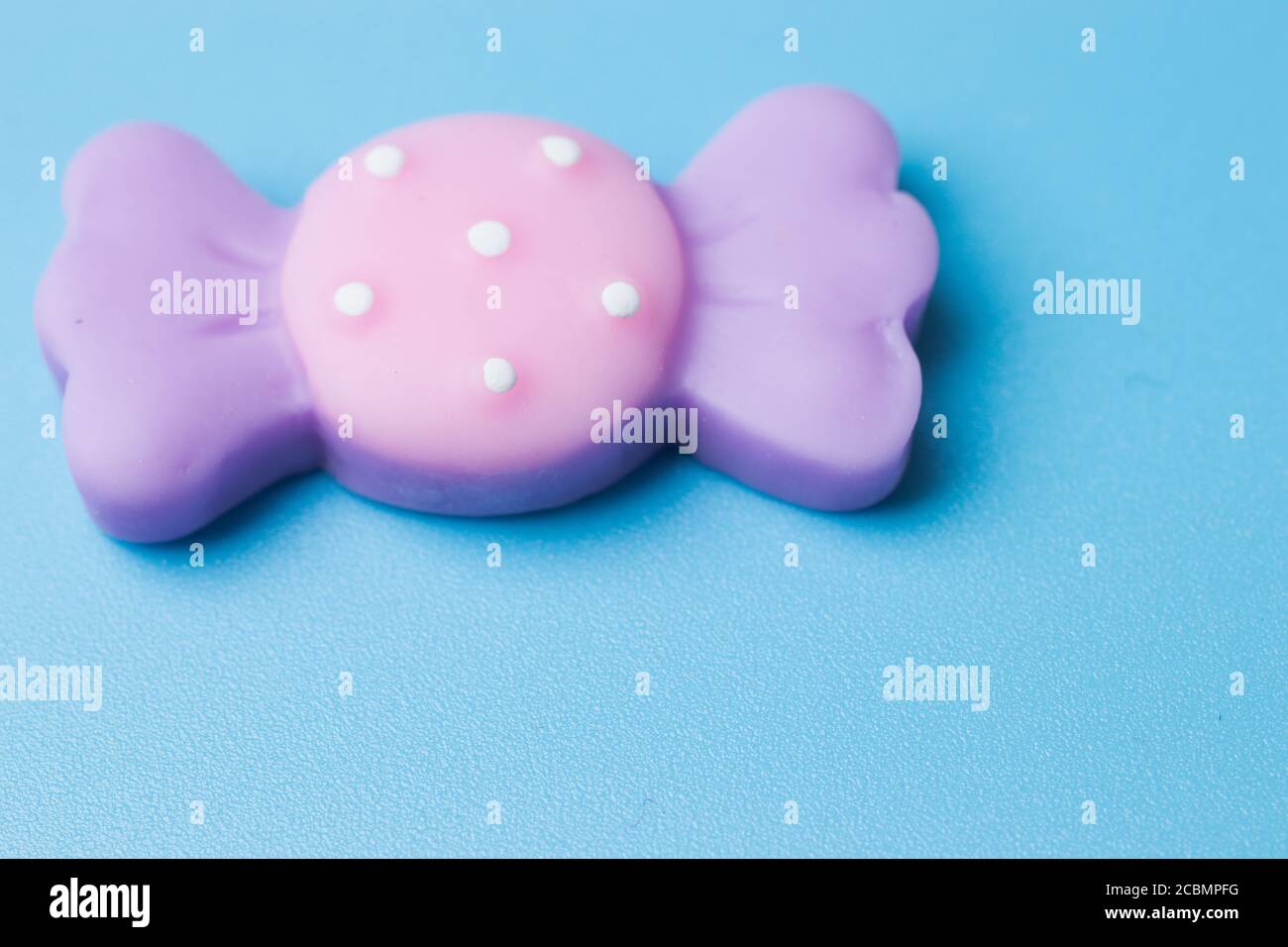 Sweet candy toy on blue background top view Stock Photo