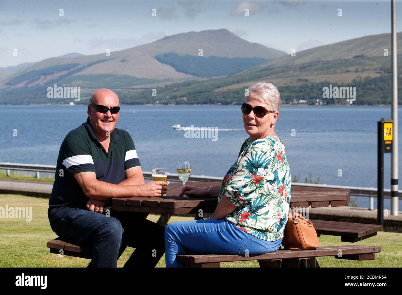 Caroline Hedley, 57, an auxiliary nurse at Hawick Community Hospital, enjoys the view with her husband David at the Loch Fyne Hotel and Spa in Inveraray, Argyll and Bute, where she and other key workers received a 'sanctuary weekend'. Stock Photo