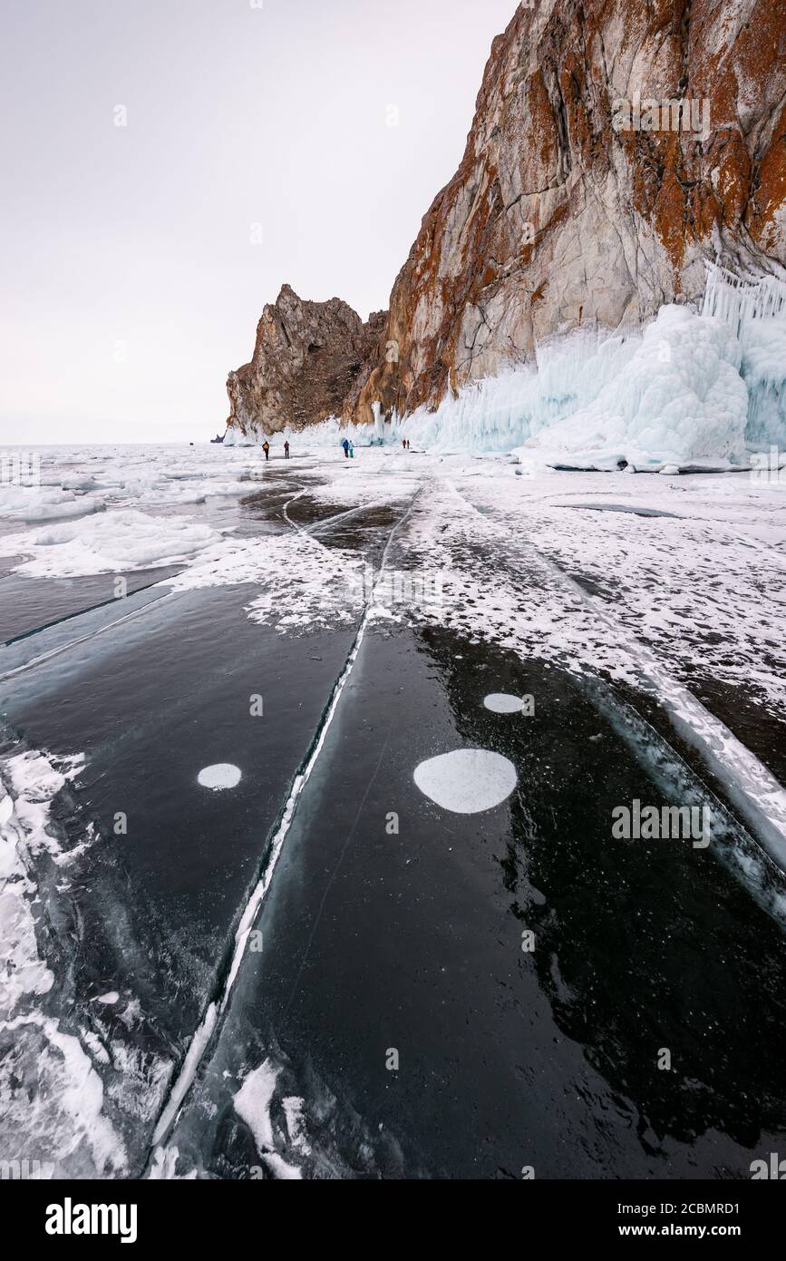 Ice cracks and methane bubbles on the frozen surface of Lake Baikal ...