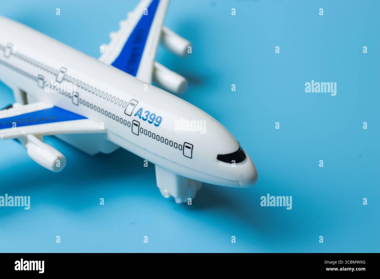 Civil Air Plane aircraft on blue background with copy space. Tourism business concept design Stock Photo
