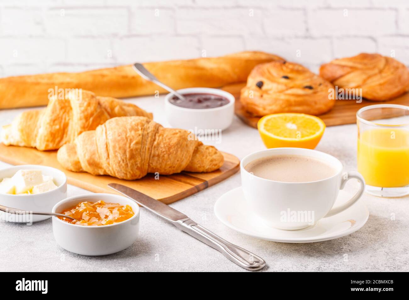 Breakfast with coffee and croissants, selective focus Stock Photo