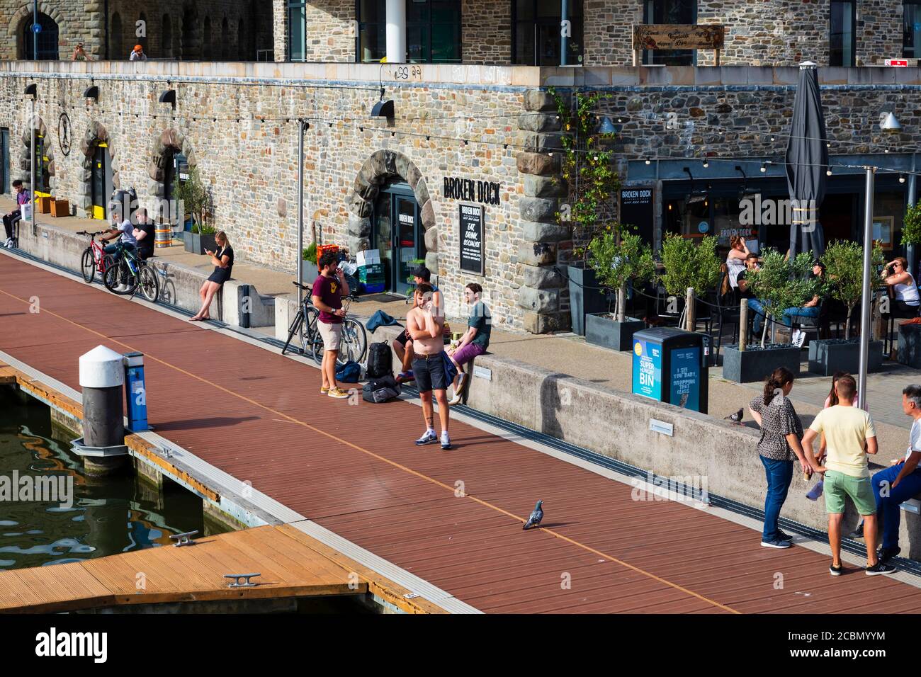 Young people on Broken Dock during Covid 19, Bristol, England. July 2020 Stock Photo