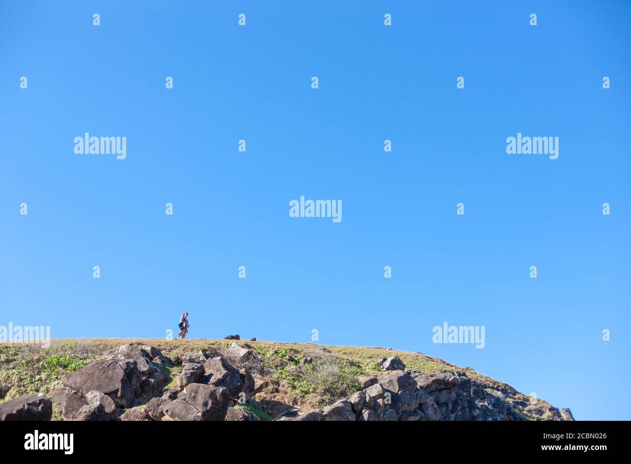 Rocky mountain hills and blue sky Stock Photo - Alamy
