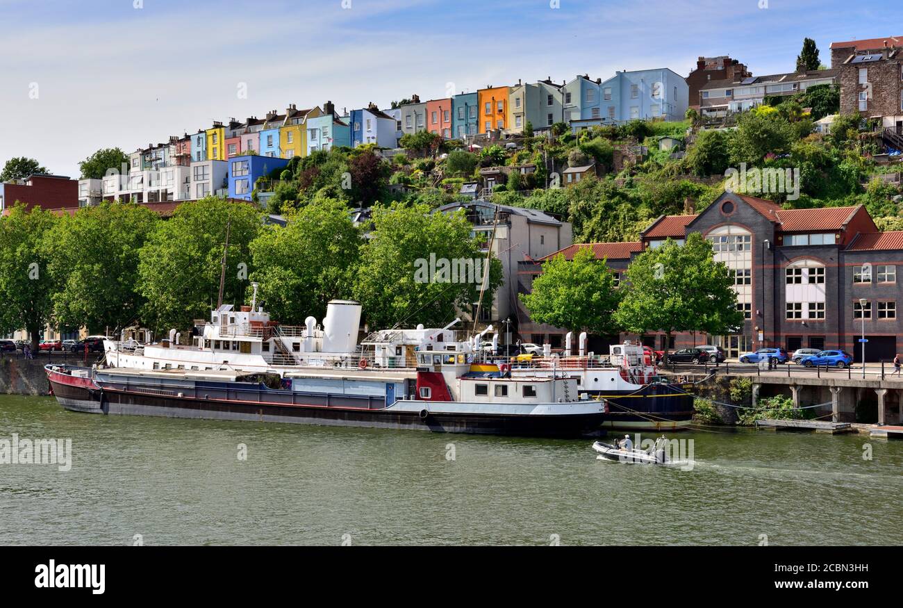 Colourful houses above Bristol floating harbour with the boats Balmoral