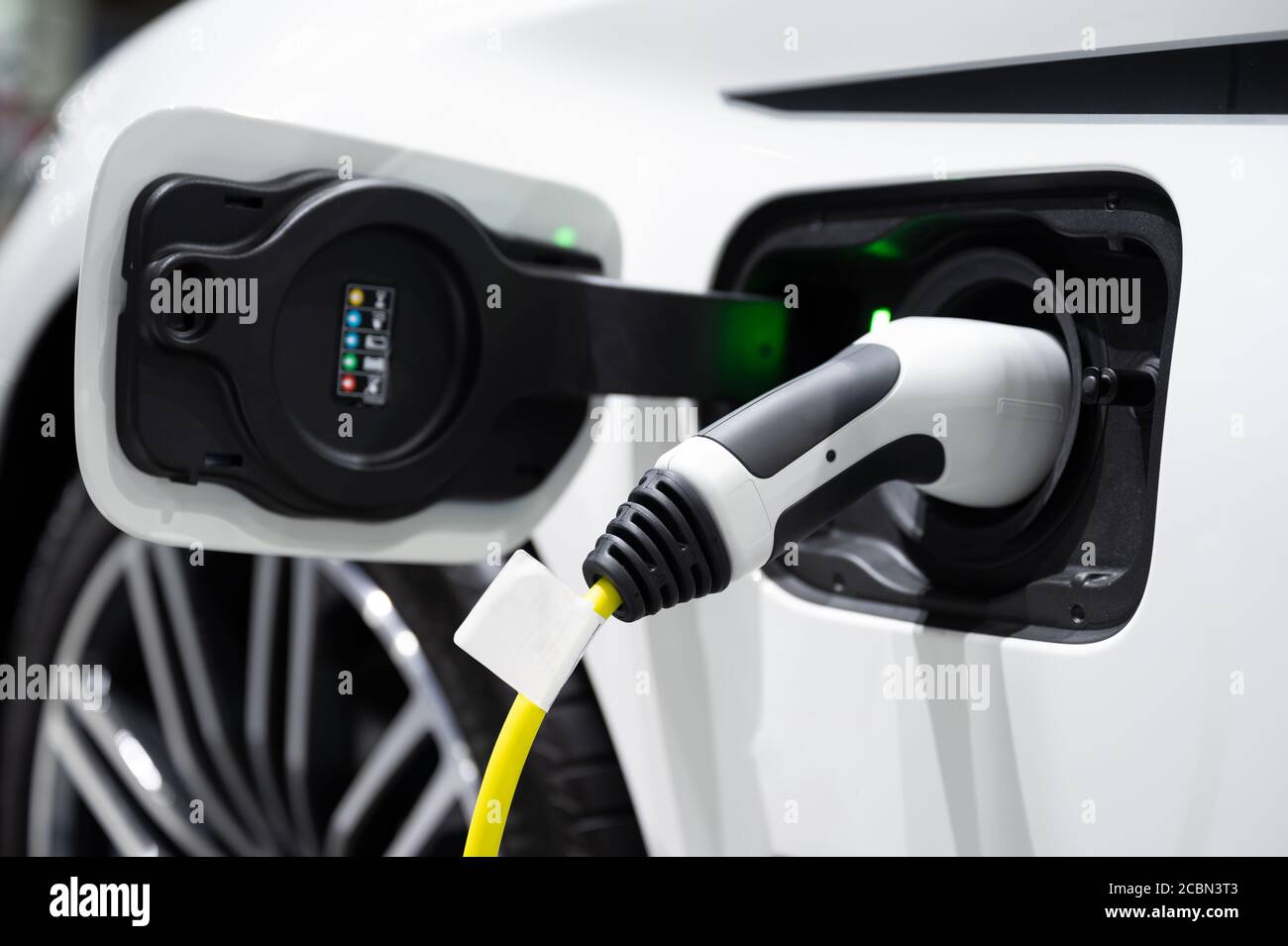 Modern electric vehicle charging in station Stock Photo - Alamy