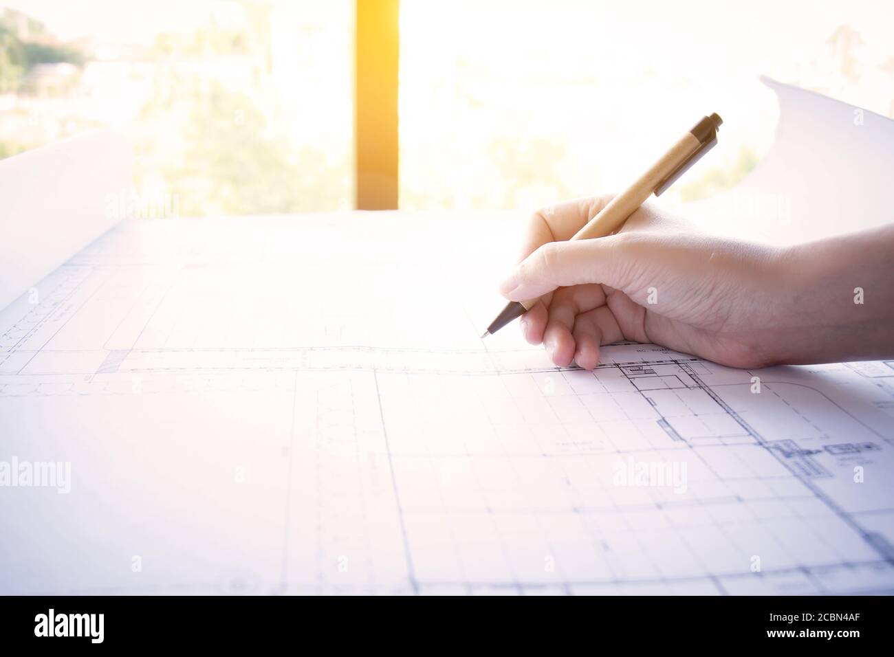 Construction , designer and renovate concept. : Architect working on blueprint, architects workplace. Architectural drawning pencil working with new s Stock Photo