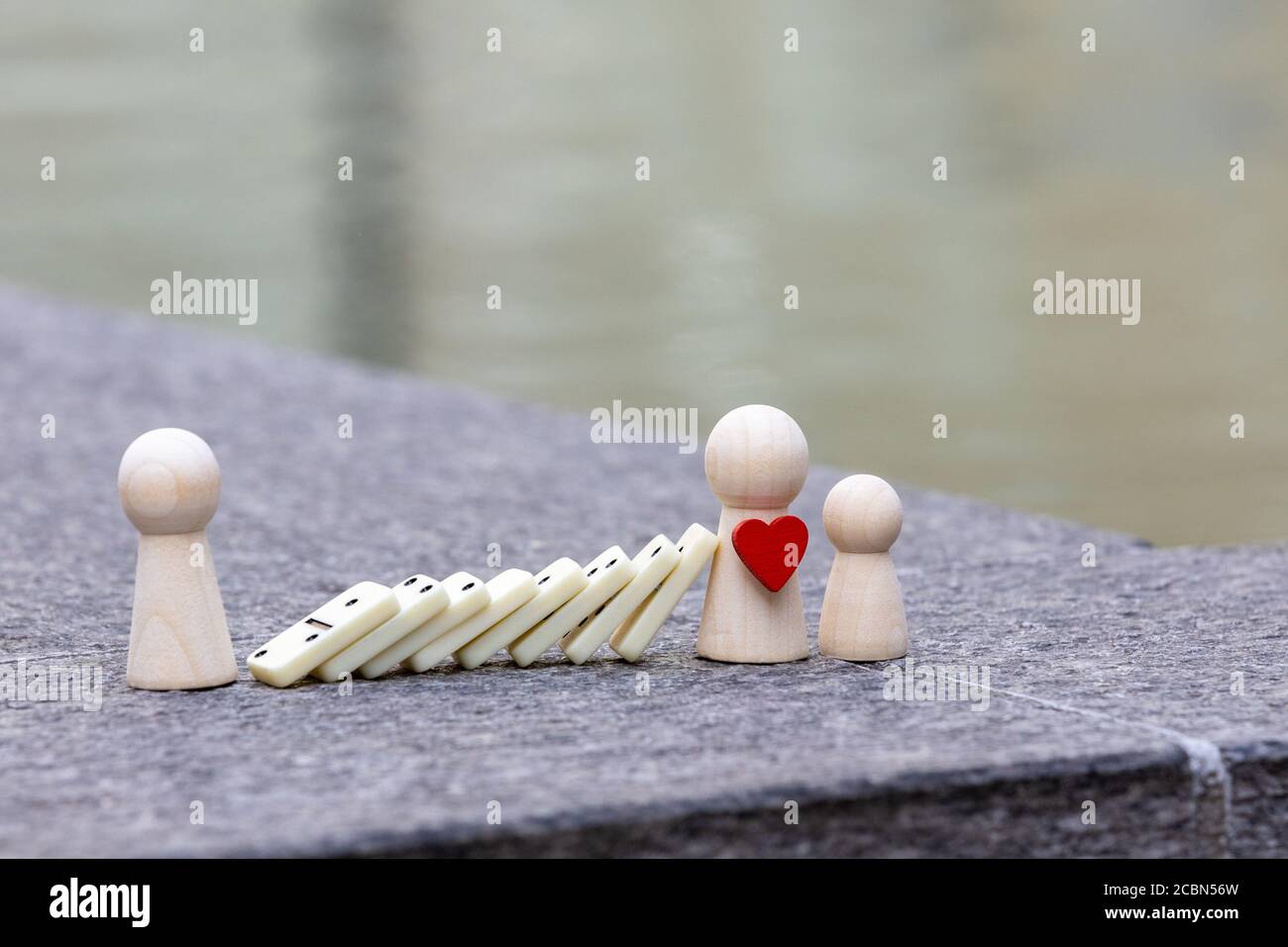resilience concept, strong people must protect the weakest people from adverse events, domino effect caused by another person Stock Photo