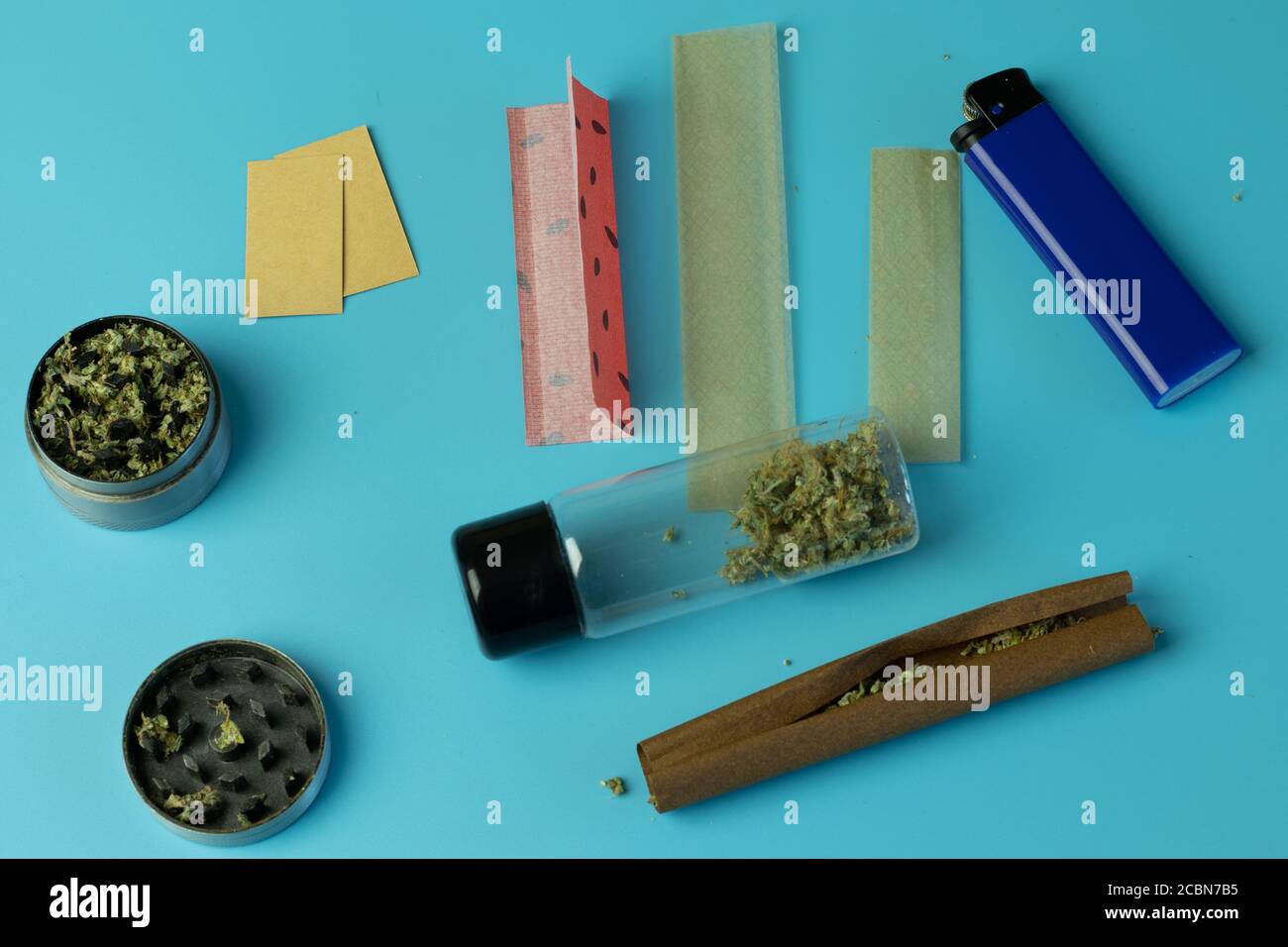 Lighter, smoking paper with filters. Cannabis blunt, marijuana joint