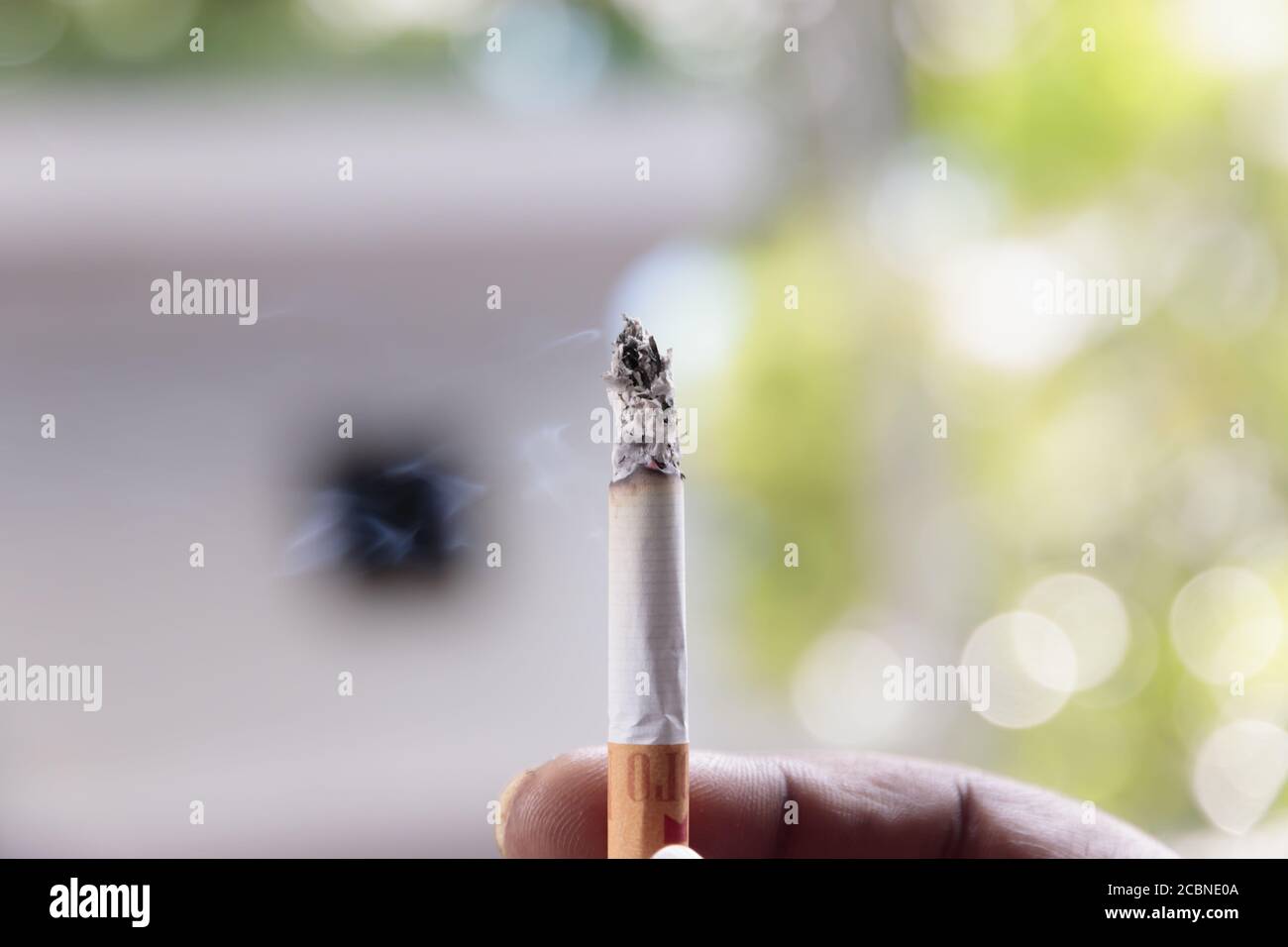 MALE, MALDIVES Mar 11, 2016 Man holding unhealthy Cigarette with