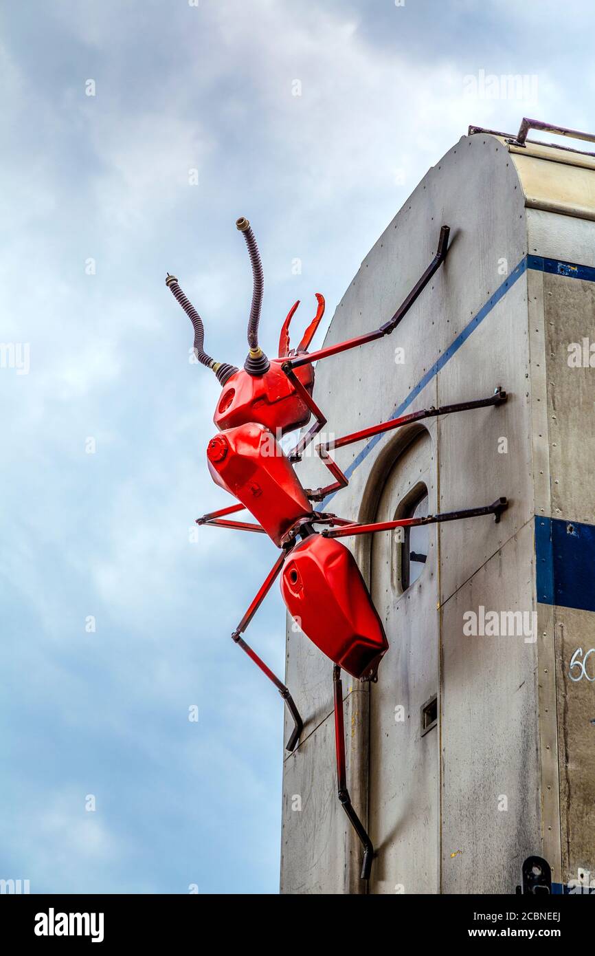 Ants created by artist Joe Rush from repurposed materials crawling over a train carriage at Vinegar Yard, London, UK Stock Photo