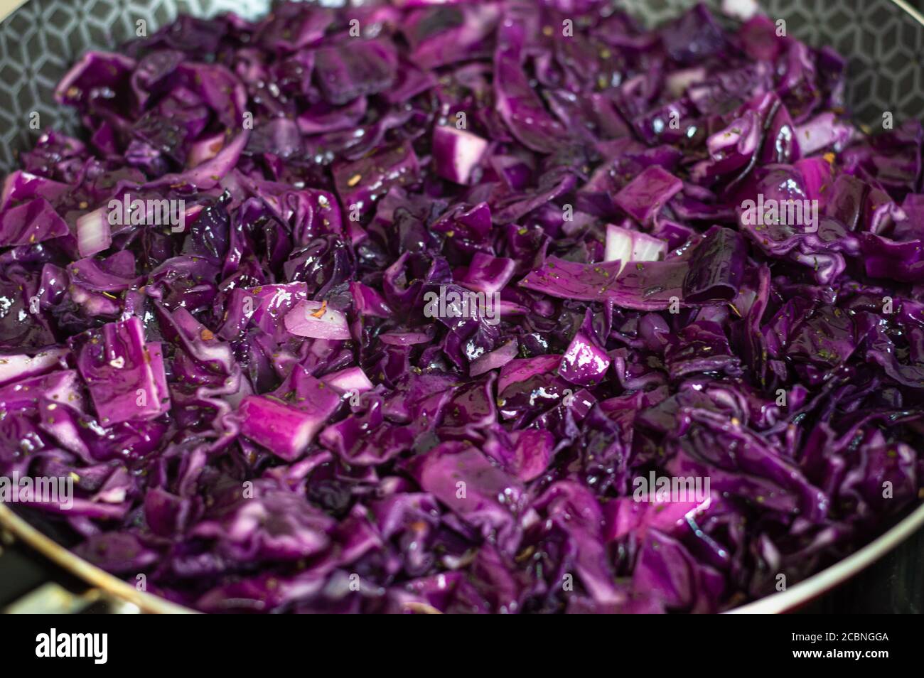 Purple cabbage in a frying pan being cooked Stock Photo Alamy