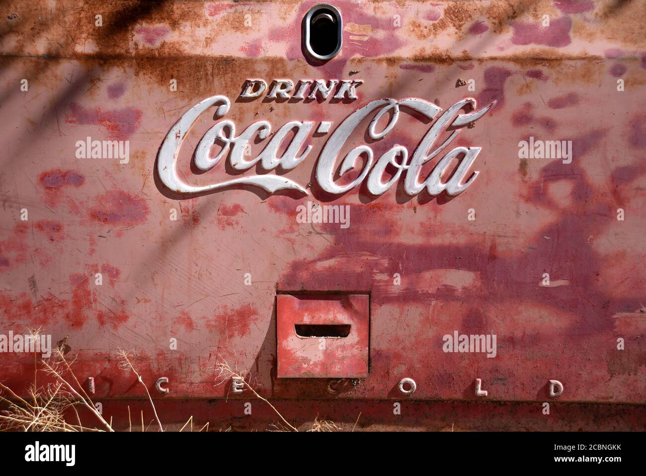 A weathered Coca-Cola vending machine in the desert town of Madrid, New Mexico USA Stock Photo