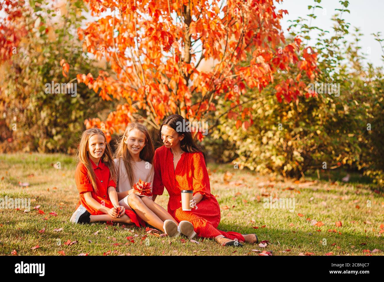 Little girl with mom outdoors in park at autumn day Stock Photo - Alamy