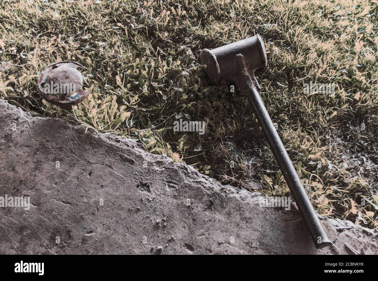 Closeup of a metal detector lying on the ground under the sunshine ...