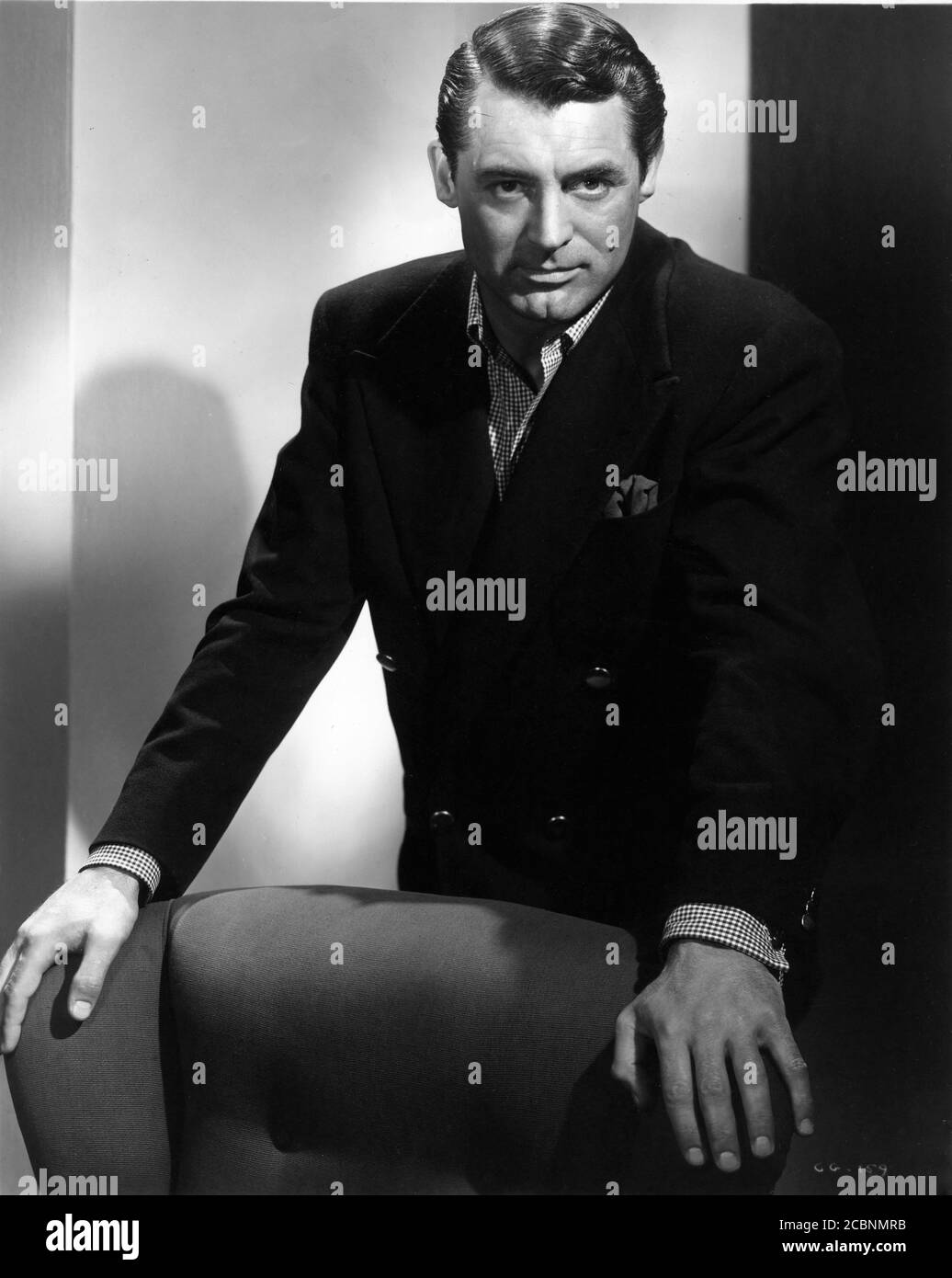 CARY GRANT Publicity Portrait for NOTORIOUS ! 1946 director ALFRED HITCHCOCK writer BEN HECHT gowns EDITH HEAD Vanguard Films / RKO Radio Pictures Stock Photo
