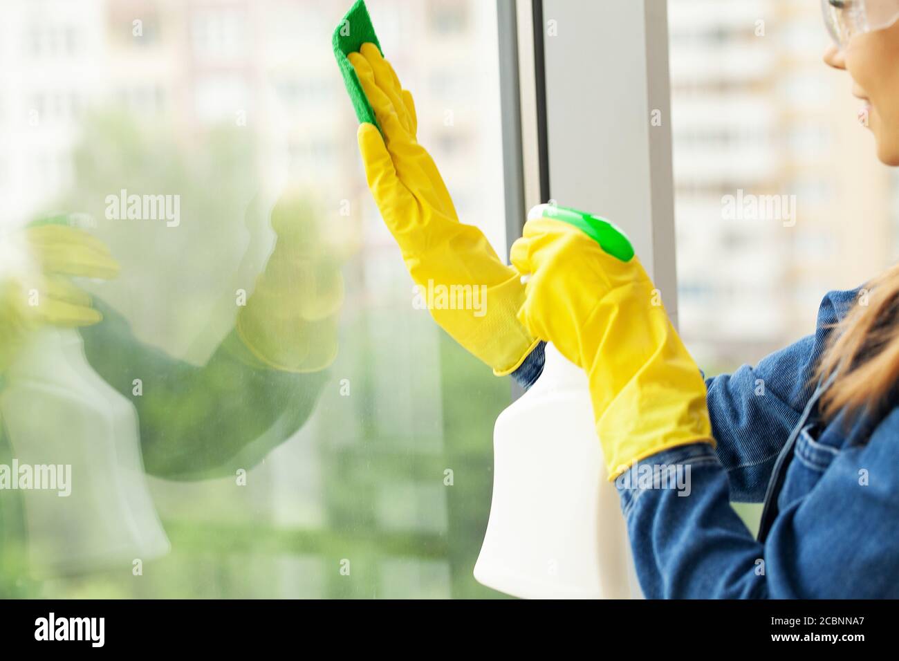 The Cleaning Lady Does The Cleaning In The Office With A Wet Cloth Stock Photo Alamy