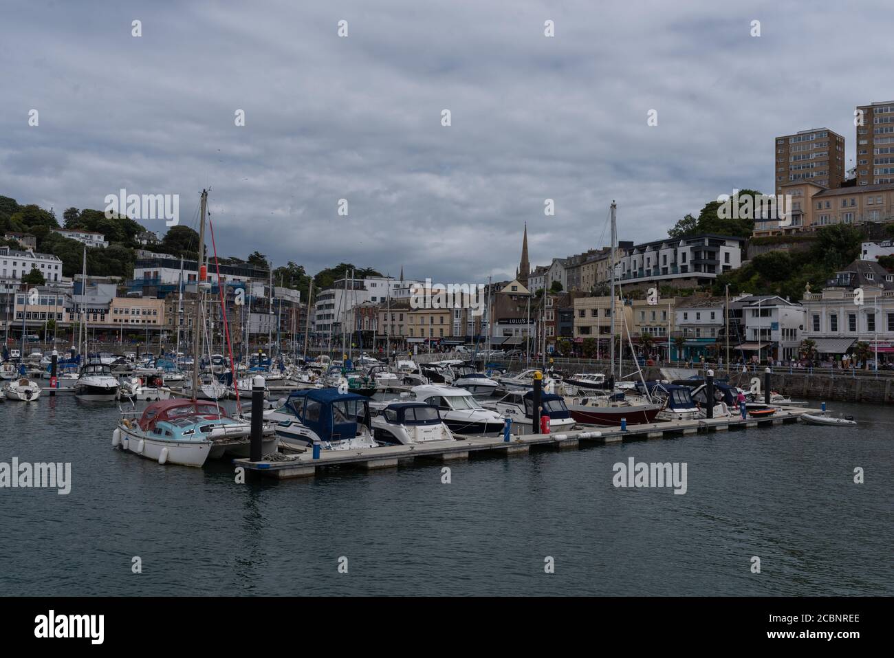 Torquay harbour on a bright cloudy day Stock Photo