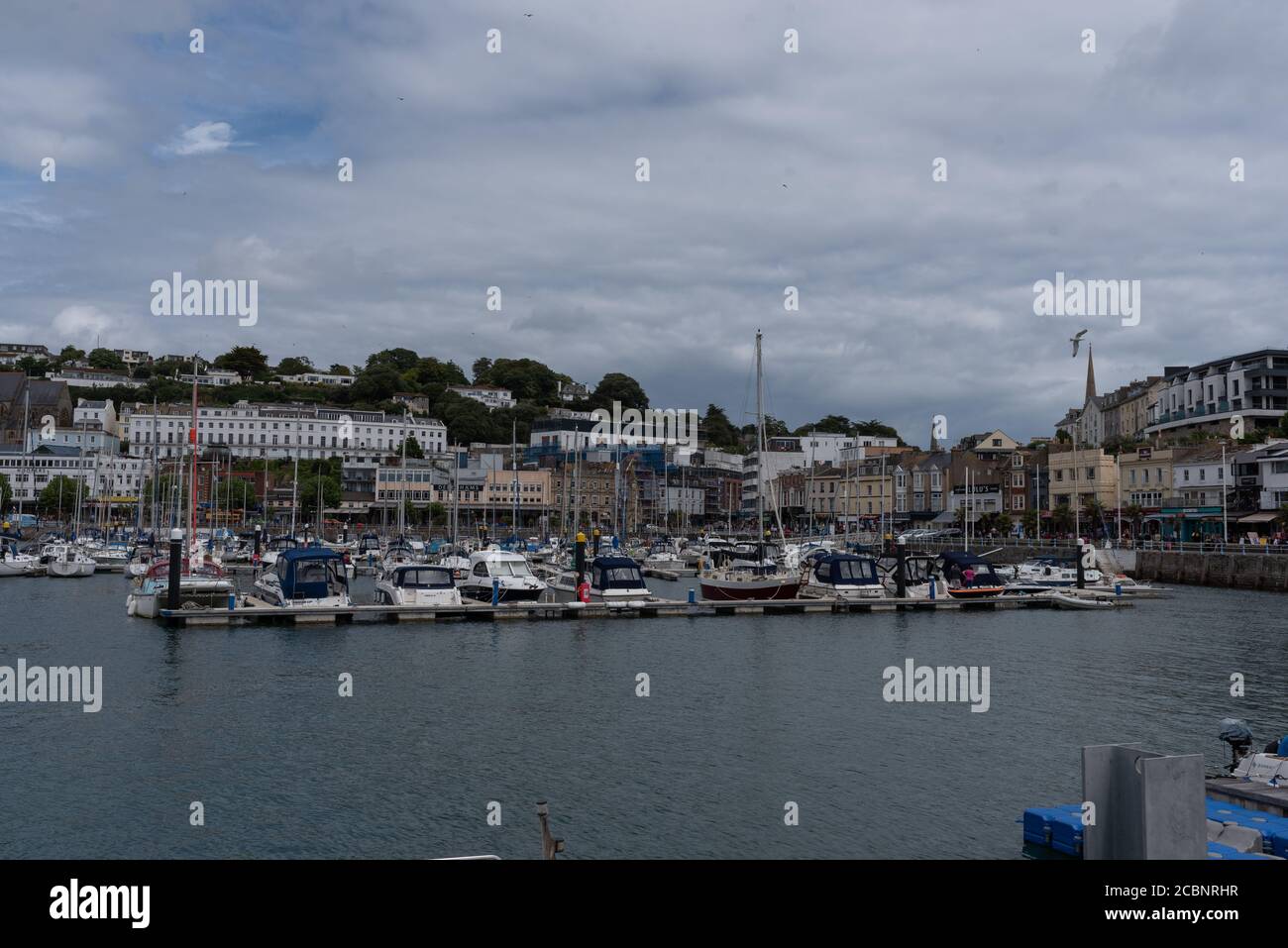 Torquay harbour on a bright cloudy day Stock Photo