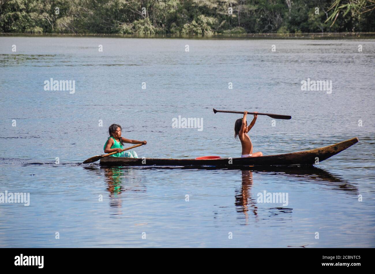 Girls in wooden boat Stock Photo