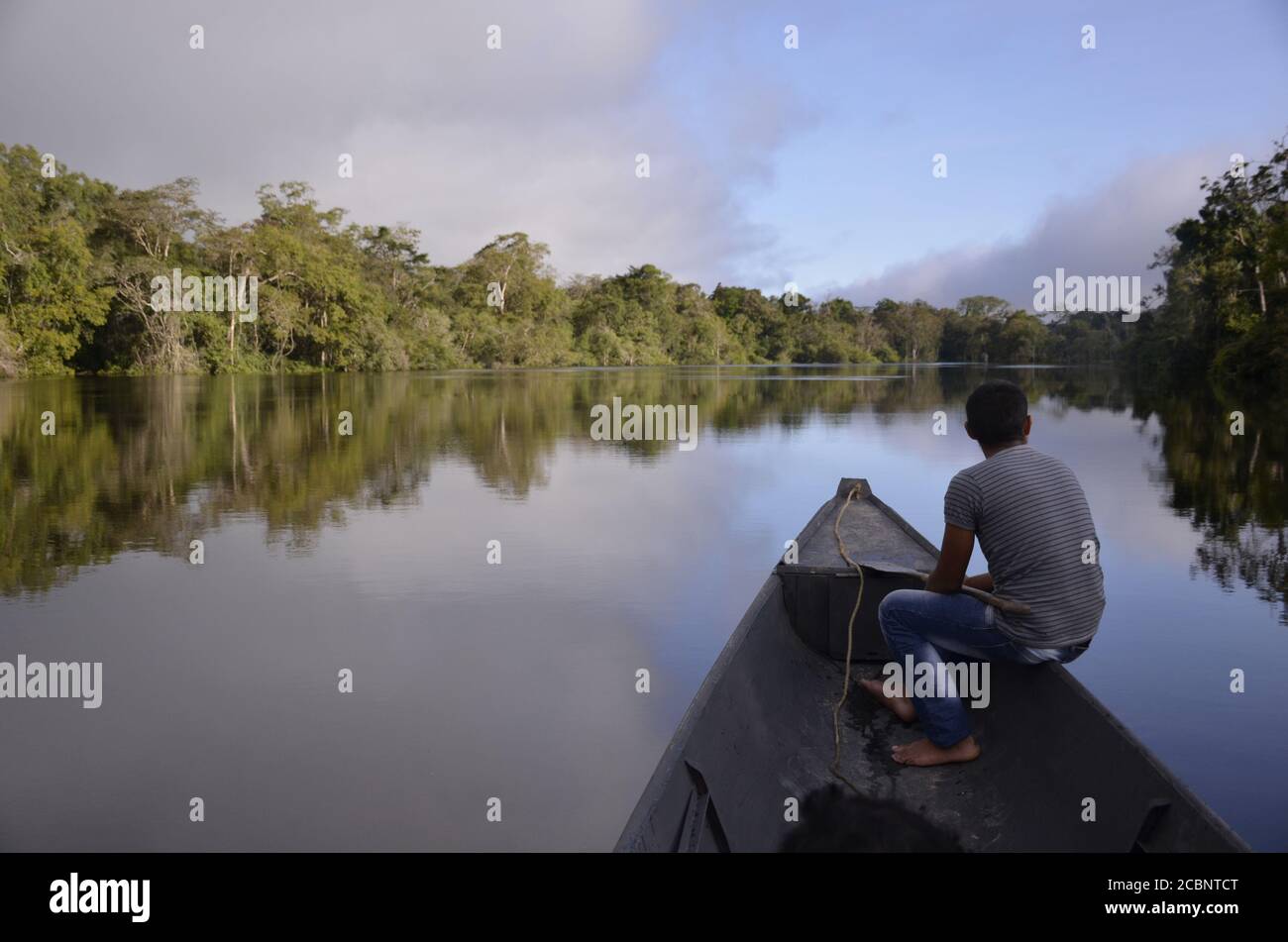 Man on boat at the jungle Stock Photo