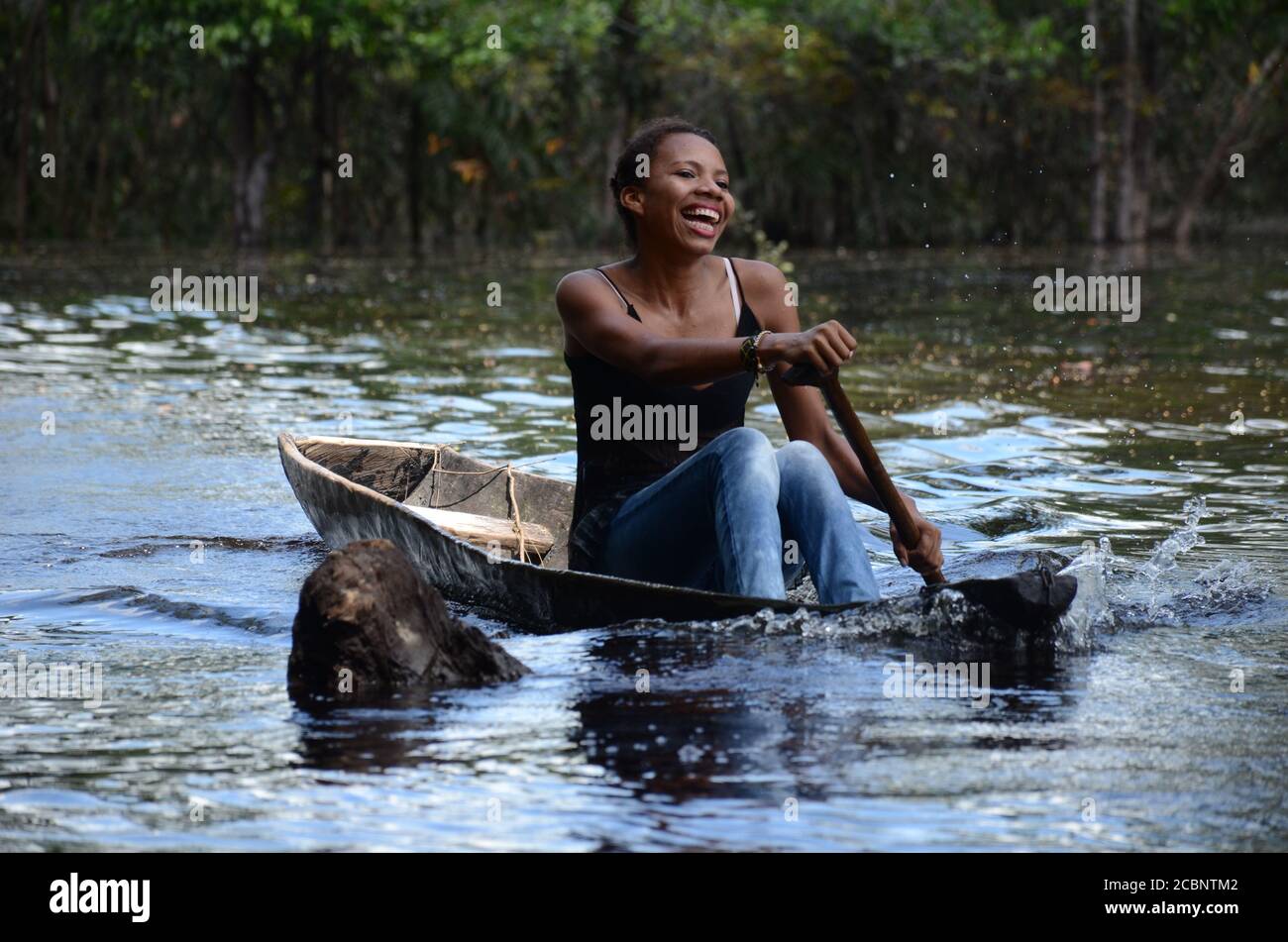 Woman at the river in the boat Stock Photo