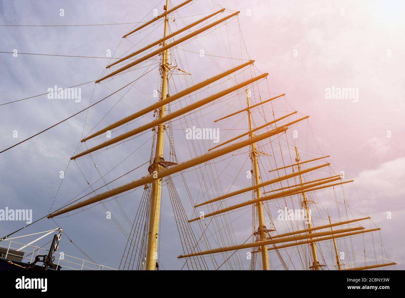 Boat masts and rigging of a sailing ship against the blue sky Stock ...