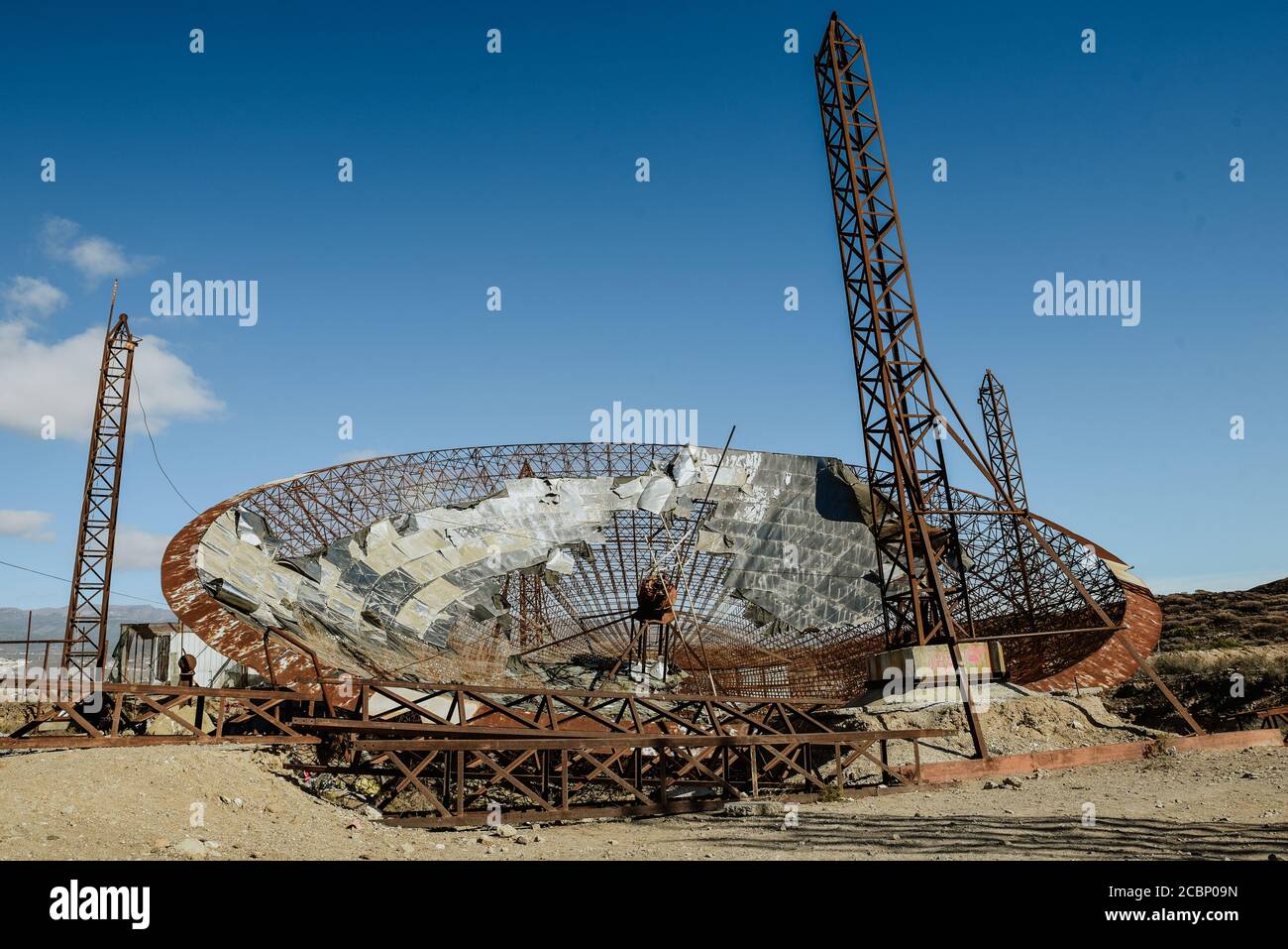 Old, abandoned and rusty parabola antenna with three towers Stock Photo -  Alamy