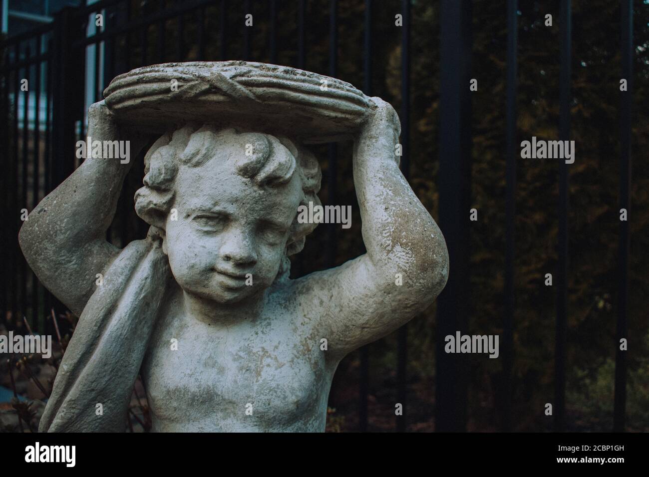 Small stone cherub statue hires stock photography and images Alamy