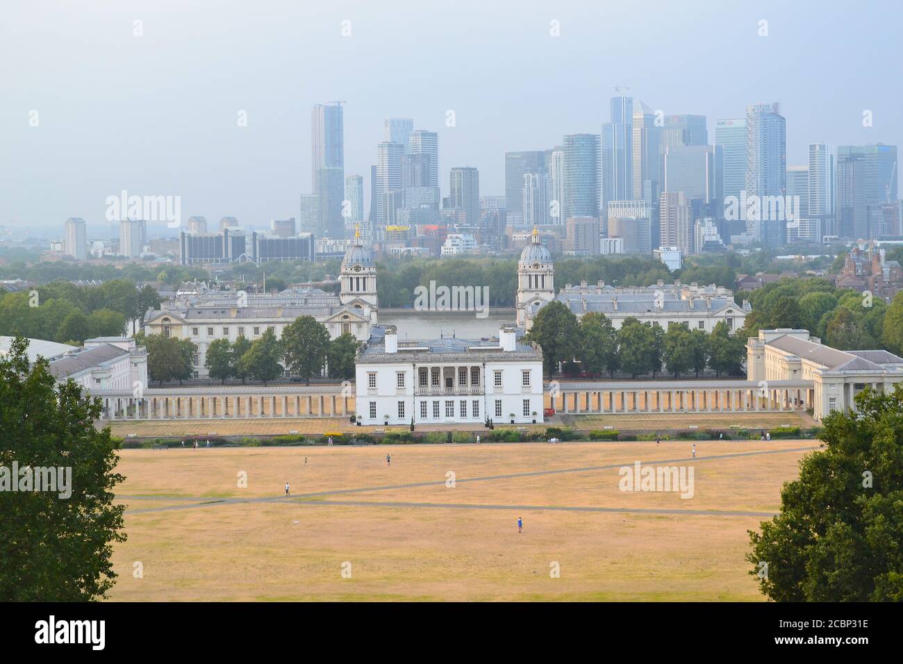 View of Canary Wharf, Queen's House, Old Naval College, Maritime Museum, Greenwich Park, from Royal Observatory, August stormy day. Stock Photo