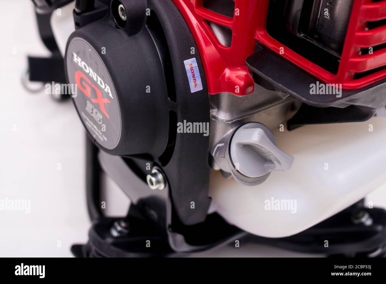 The engine oil tank and its cover of Honda GX35 engine which would be found  in Honda umr435 and umk435 grass trimmer was took a photo under lighting s  Stock Photo -