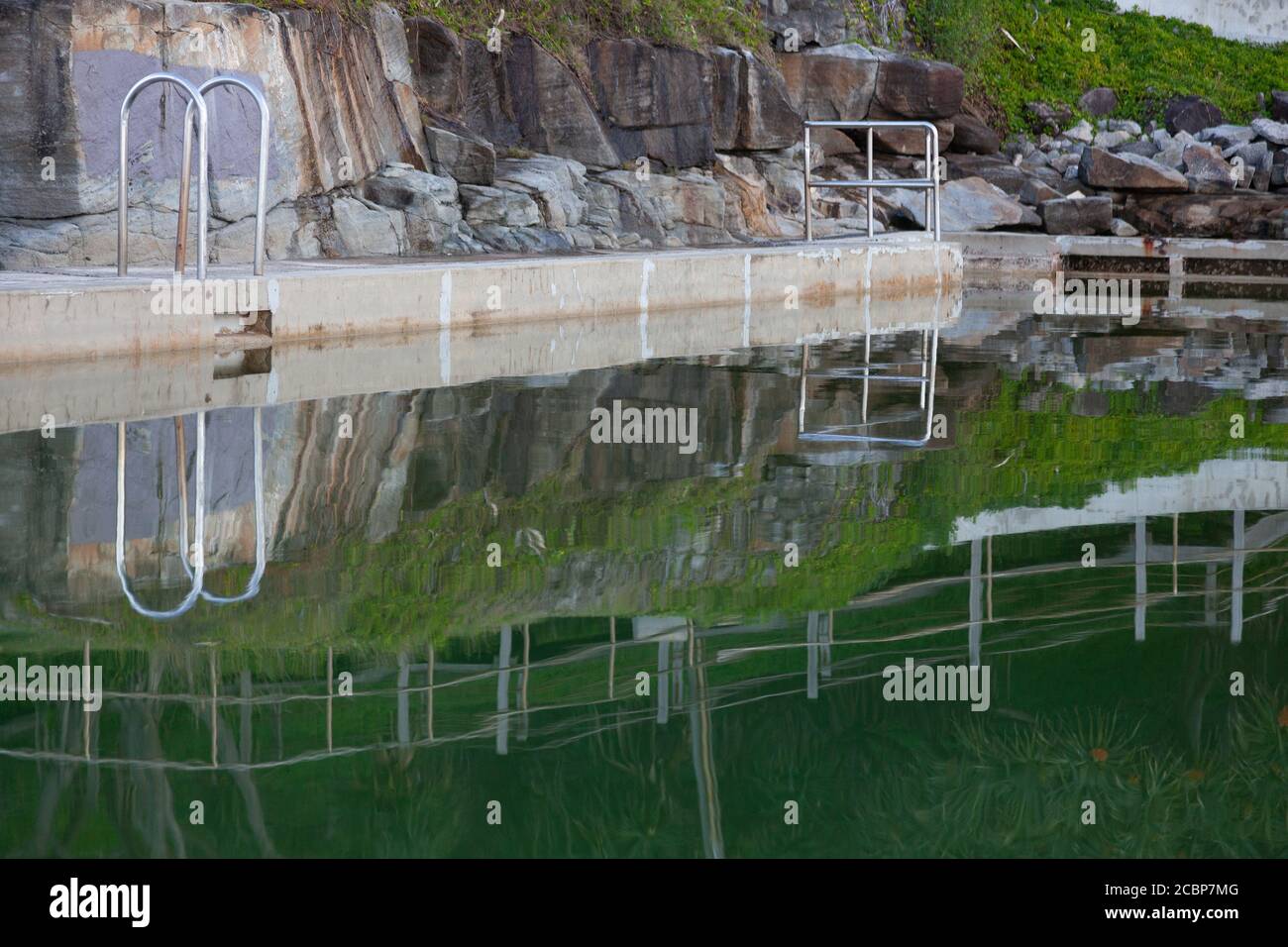 Reflections at the Ocean Pool, Yamba, New South Wales, Australia Stock Photo
