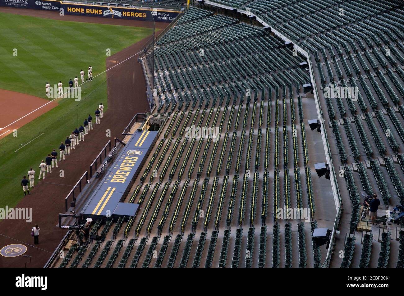 August 11, 2020: Brewers stand in front of dugout for National Anthem before the Major League Baseball game between the Milwaukee Brewers and the Minnesota Twins at Miller Park in Milwaukee, WI. John Fisher/CSM Stock Photo