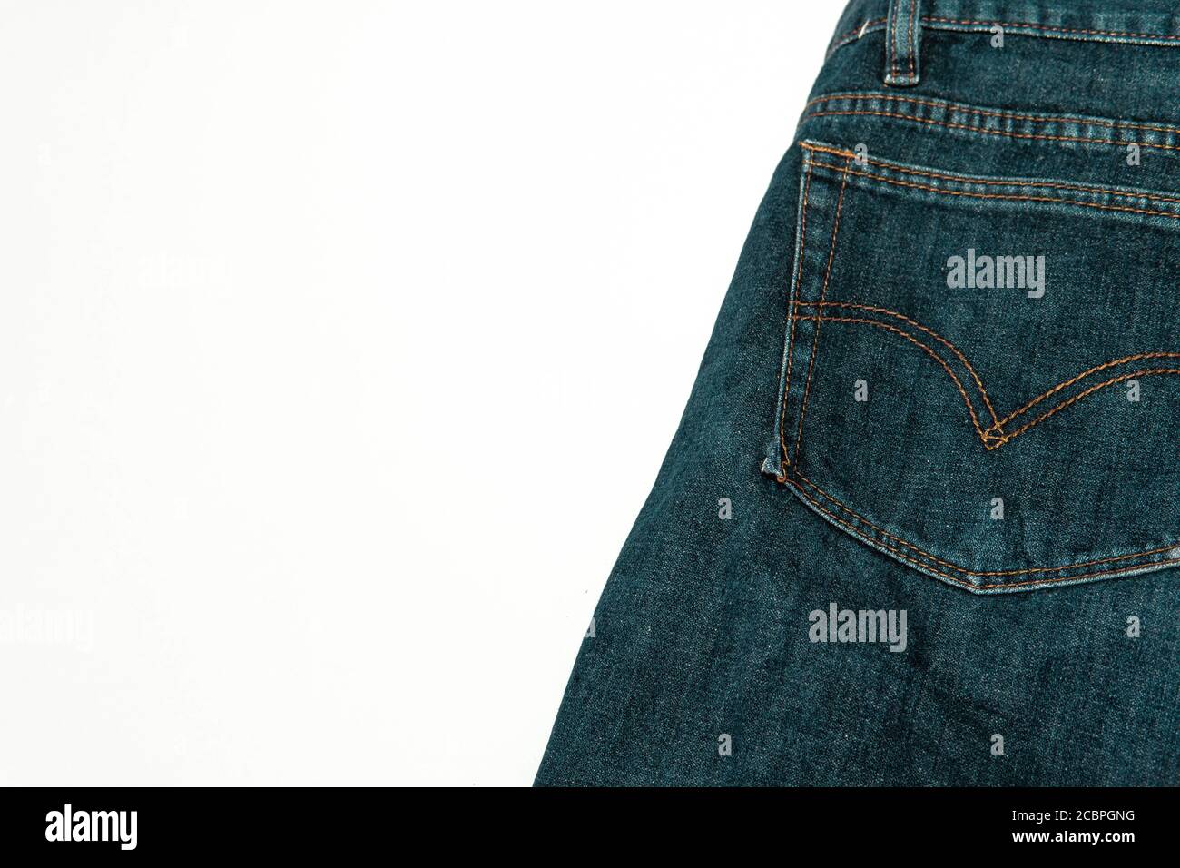 Closeup shot of a patch pocket of blue jeans on white background Stock  Photo - Alamy