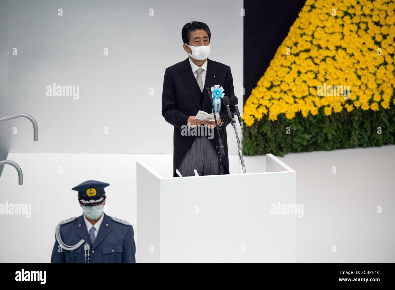 Tokyo, Japan. 15th Aug, 2020. TOKYO, JAPAN - AUGUST 15: Japan's Japan's Prime Minister, Shinzo Abe, makes a speech during a memorial service marking the 75th anniversary of Japan's surrender in World War II at the Nippon Budokan hall on August 15, 2020 in Tokyo, Japan. 75 years ago today and following the atomic bomb attacks on Hiroshima and Nagasaki, former emperor Hirohito formally announced Japan's surrender to allied forces, bringing the hostilities of World War II to an end. Credit: POOL/ZUMA Wire/Alamy Live News Stock Photo