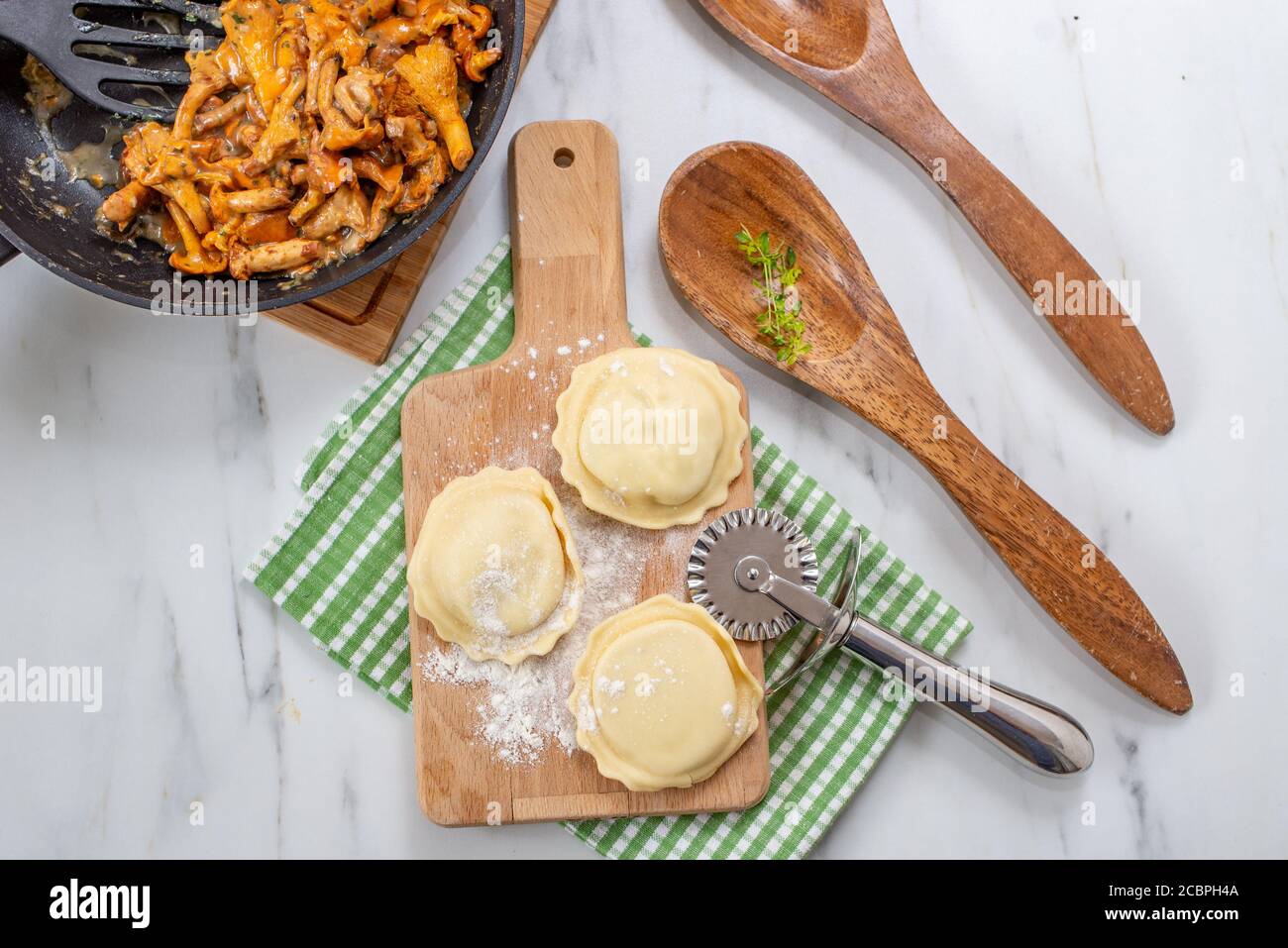 home made Italian ravioli with fresh roasted chanterelles Stock Photo