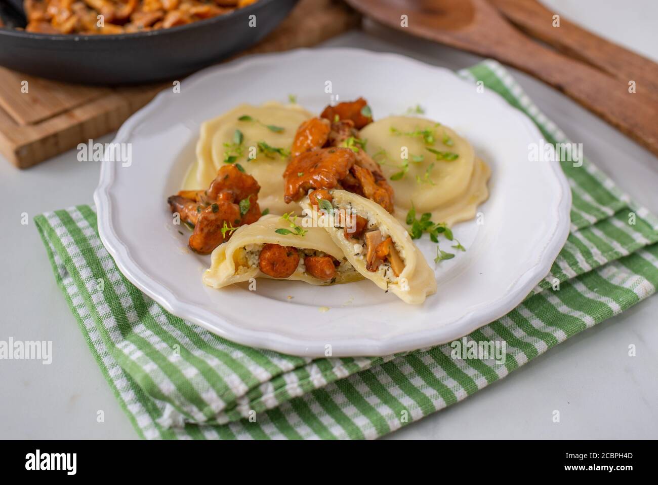 home made Italian ravioli with fresh roasted chanterelles Stock Photo