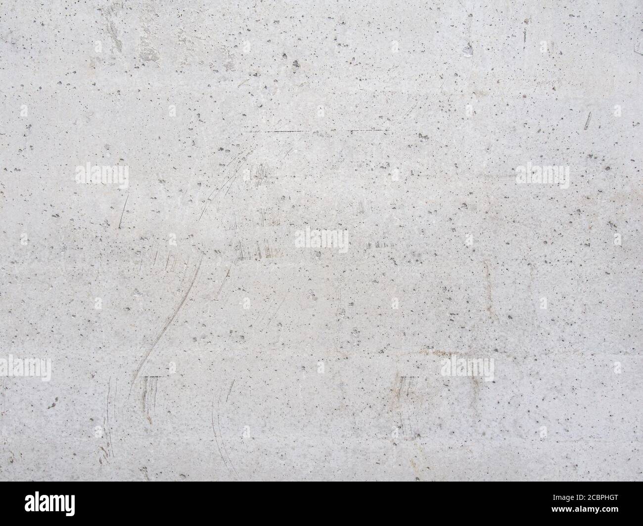 Construction and reconstruction. The background texture of the outer wall surface of a reinforced concrete slab of a residential building made of gray Stock Photo