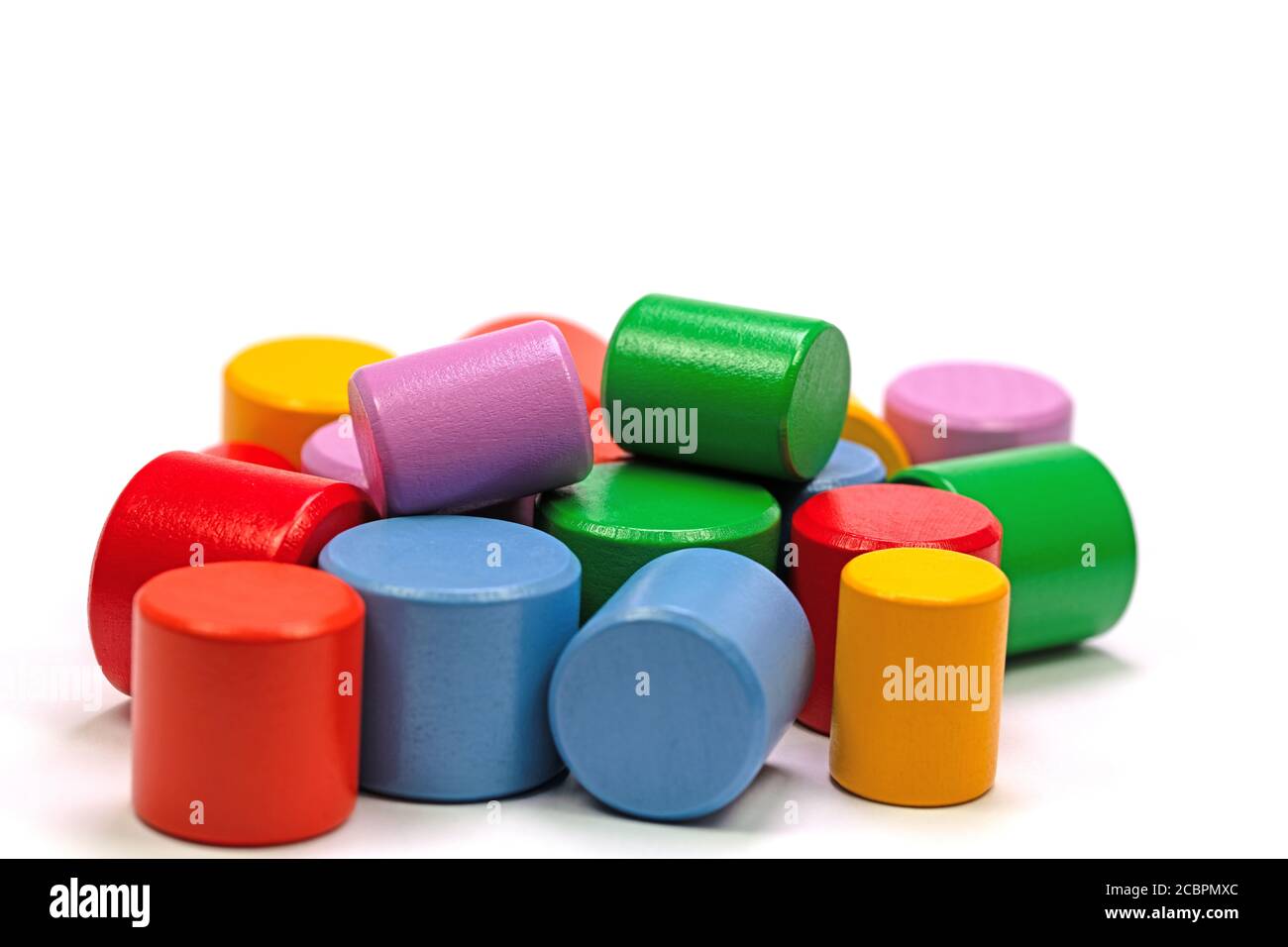 Colorful wooden blocks against a white background Stock Photo - Alamy