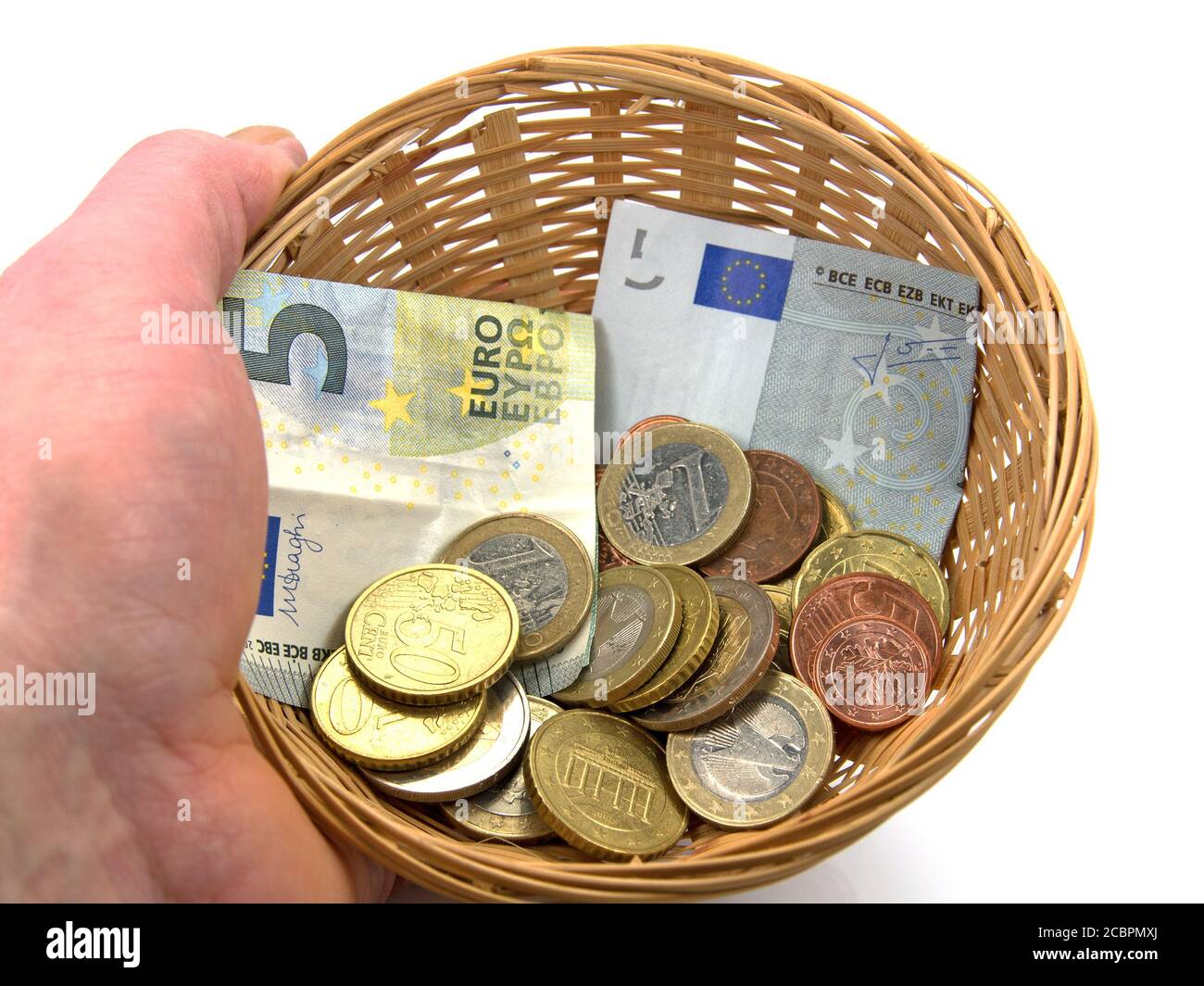 Hand holding a basket for collecting money Stock Photo